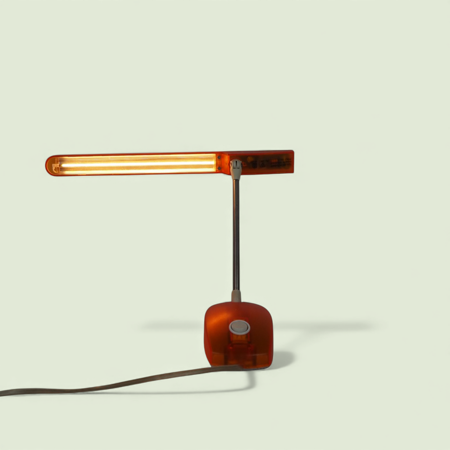 Desk lamp Microlight Artemide pomarańczowa, widok z przodu, Italian design 1990s